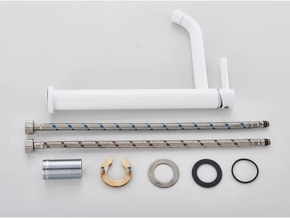 White modern bathroom faucet brushed gold mixer tap with sleek minimalist design and chrome finished flexible hoses
