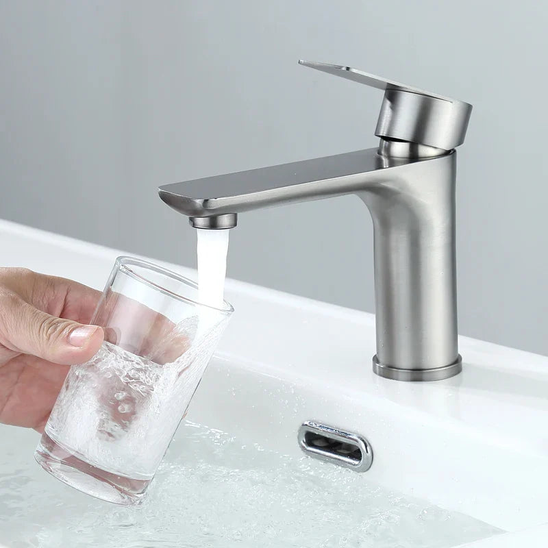 Modern brushed stainless steel bathroom faucet with sleek minimalist design for deck-mounted installation