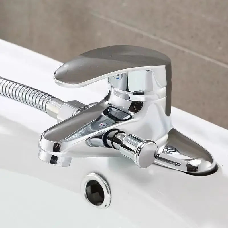Chrome finished deck mounted single-handle bathroom mixer faucet with flexible hose and integrated spout for washbasin use