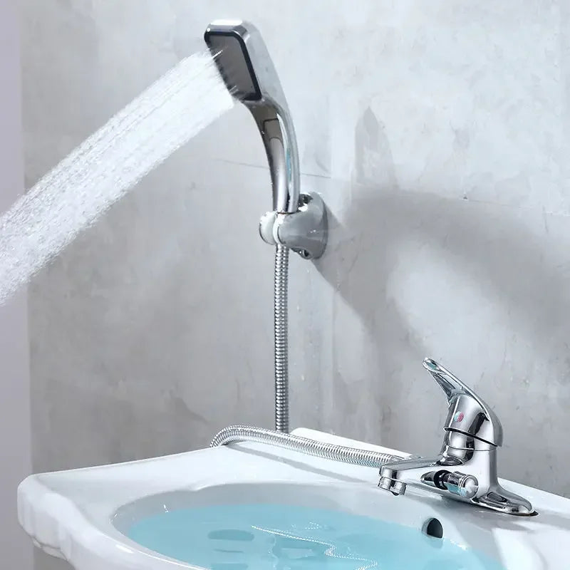 Chrome finished deck mounted handheld showerhead with flexible metal hose attached to wall bracket for bathroom use
