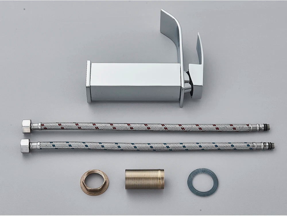 Modern chrome-finished brass bathroom sink faucet with sleek minimalist design and stainless steel flexible hoses