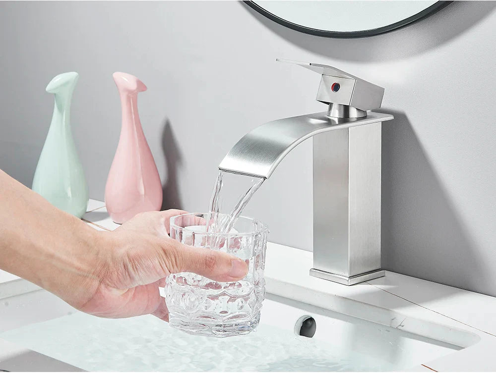 Modern brushed stainless steel bathroom sink faucet deck mount with sleek curved waterfall spout
