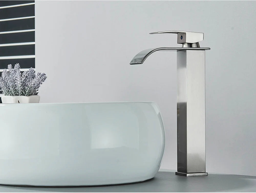 Modern brushed stainless steel bathroom sink faucet with waterfall design and sleek rectangular spout deck mount