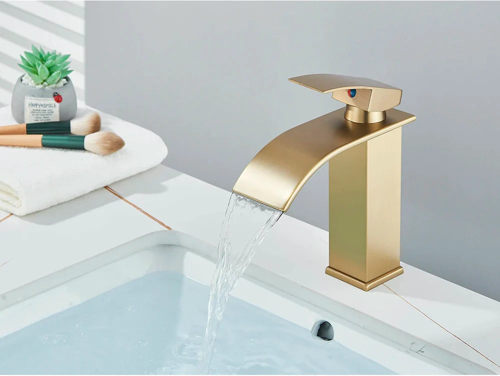 Bathroom sink faucet brass deck mount with gold-toned stainless steel waterfall spout and brushed modern finish