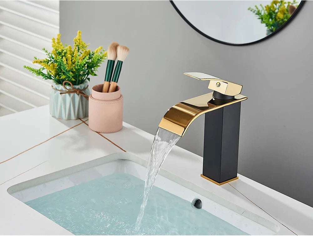Modern bathroom sink faucet brass deck mount with sleek black and gold finish stainless steel curved waterfall spout