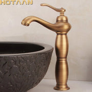 Antique brass-finished single-handle bathroom tall basin faucet with a classic elegant design for bathroom use
