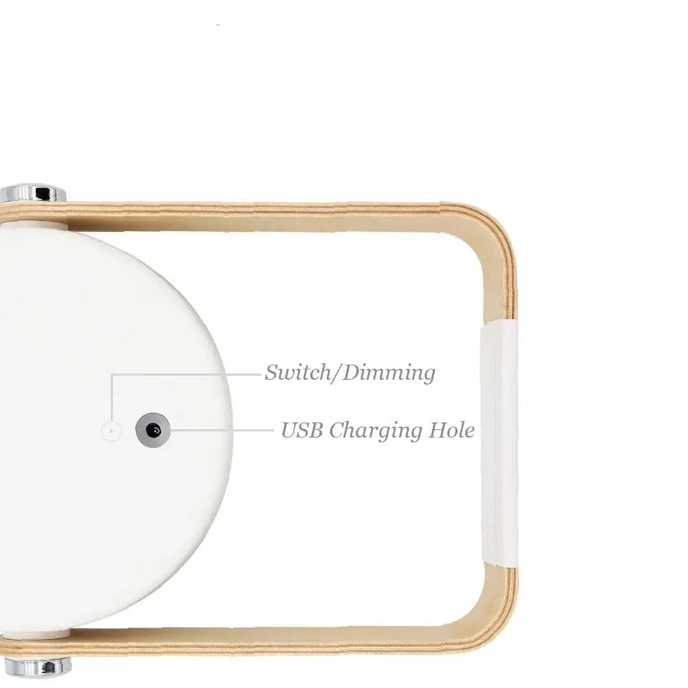 Minimalist white circular battery-operated wall sconce lantern with light wood frame and chrome accents