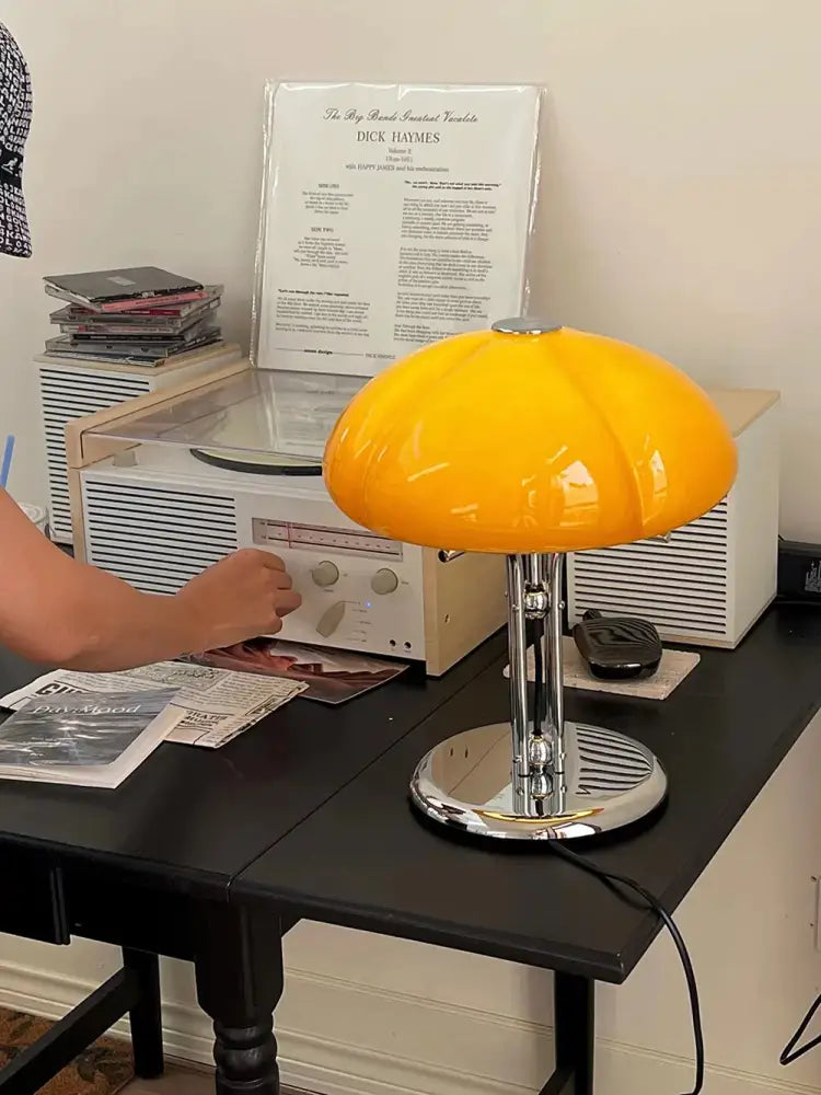 Vibrant yellow glossy bauhaus medieval table lamp with chrome base and stem for bedroom atmosphere lighting
