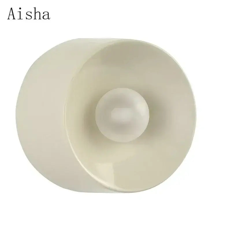 Cream-colored glossy plastic candle holder with central spherical indentation for bauhaus metal wall lamp sconce