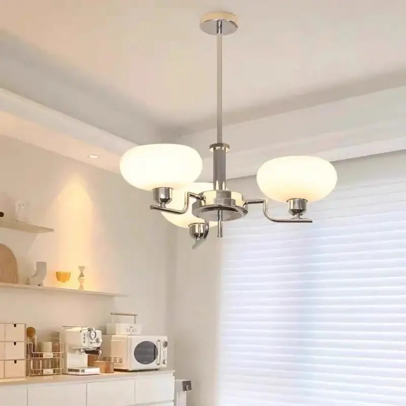 Modern chrome-finished bauhaus glass pendant chandelier with three frosted white glass shades for dining room use