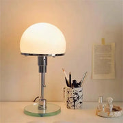 Bauhaus chrome table lamp with milk white glass dome shade and circular mirrored base for bedroom lighting