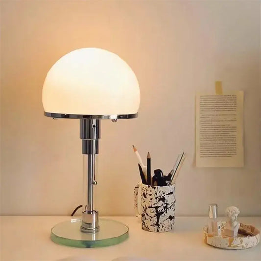 Bauhaus chrome table lamp with milk white glass dome shade and circular mirrored base for bedroom lighting
