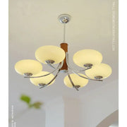 Modern bauhaus art glass chandelier with five frosted shades, chrome frame, and wooden column for living room lighting
