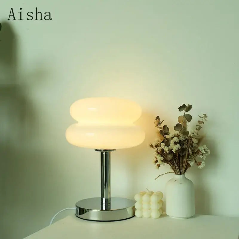 Aisha bauhaus glass table lamp with a sleek chrome base and two stacked off-white glass shades for bedroom light