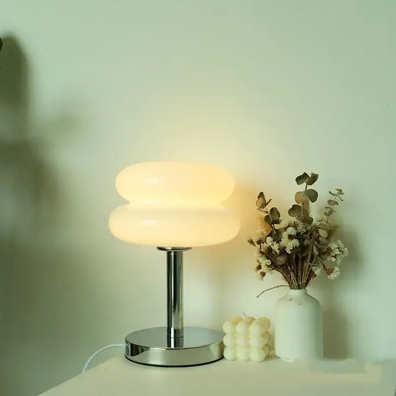 Bauhaus glass table lamp with sleek chrome base and stacked frosted yellow glass shades for bedroom lighting