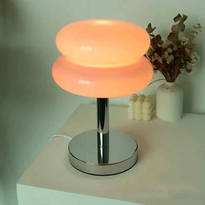 Bauhaus glass table lamp with warm orange translucent glass shade and sleek chrome base for bedroom light