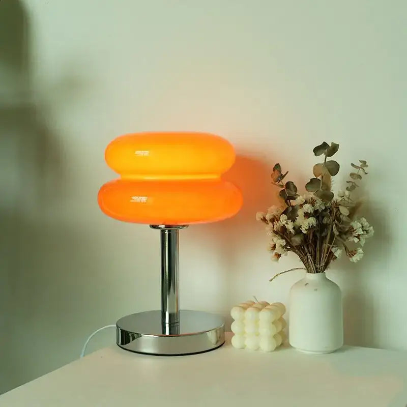 Vibrant orange double-layered bauhaus glass table lamp with sleek chrome base for bedroom lighting use