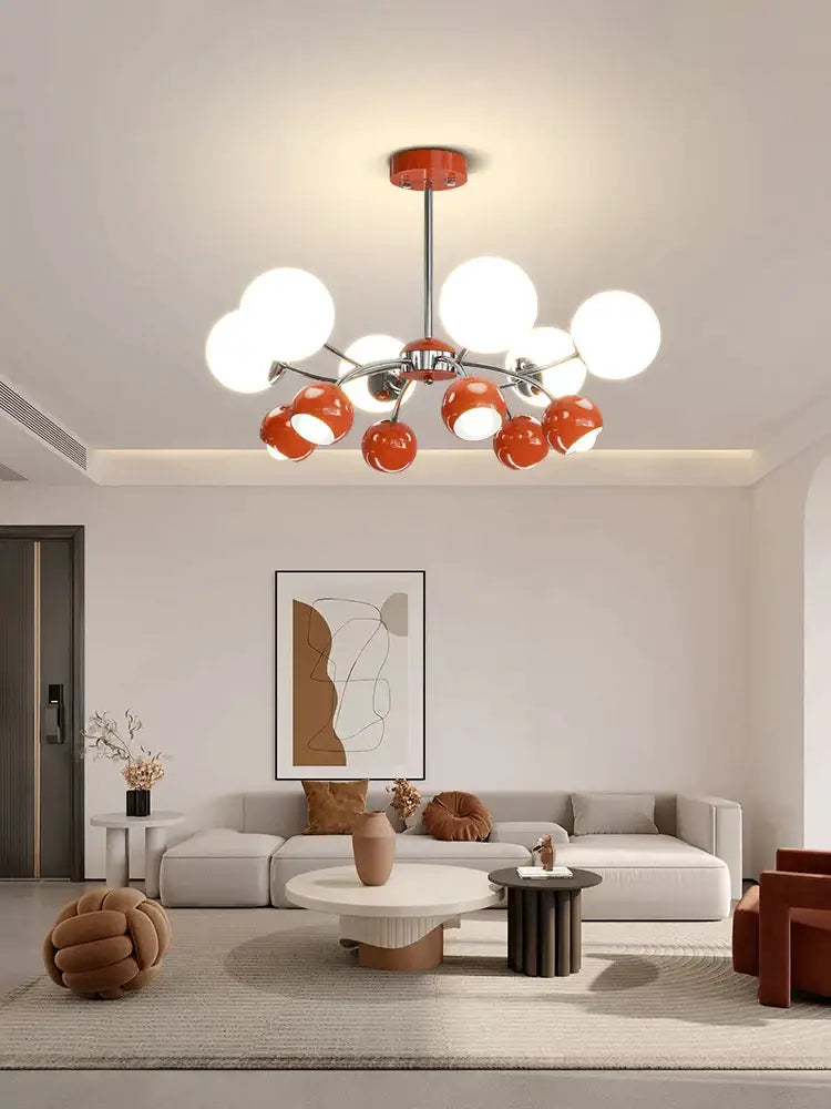 Modern lasha pendant light with chrome stem orange spherical shades and white globe lights for dining room use