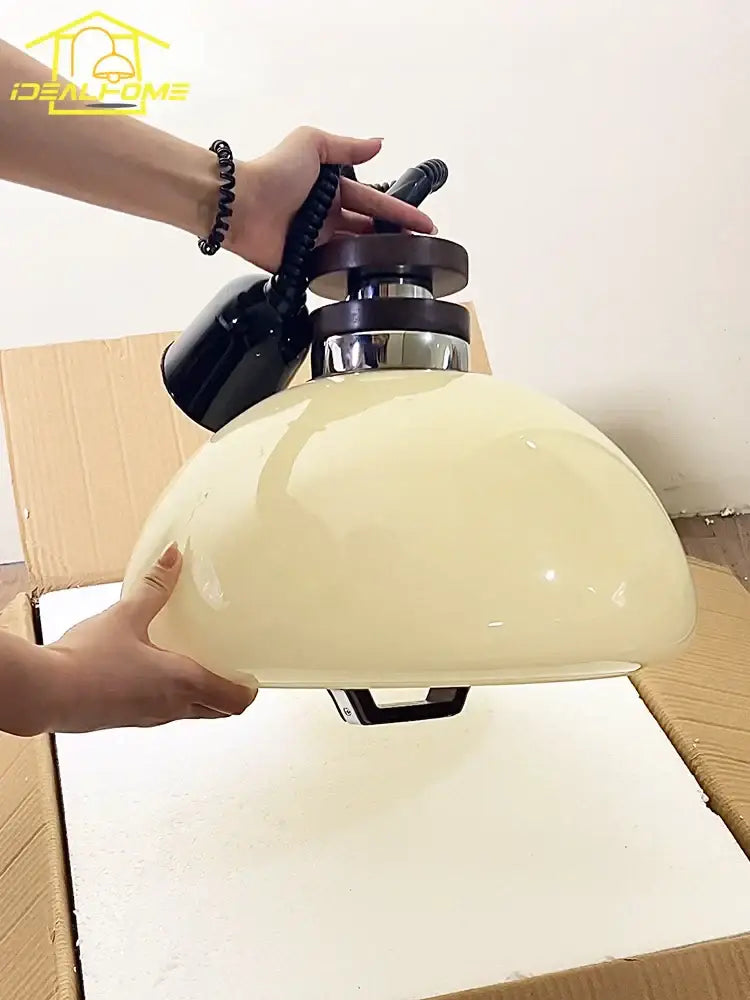 Bauhaus cream glass pendant light with glossy finish black metal fixture and chrome accents ideal for dining room decor