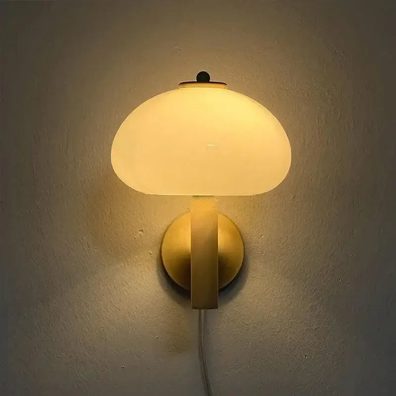 Warm-toned decorbites cream mushroom wall light with frosted cream mushroom glass and brass-finished metal base