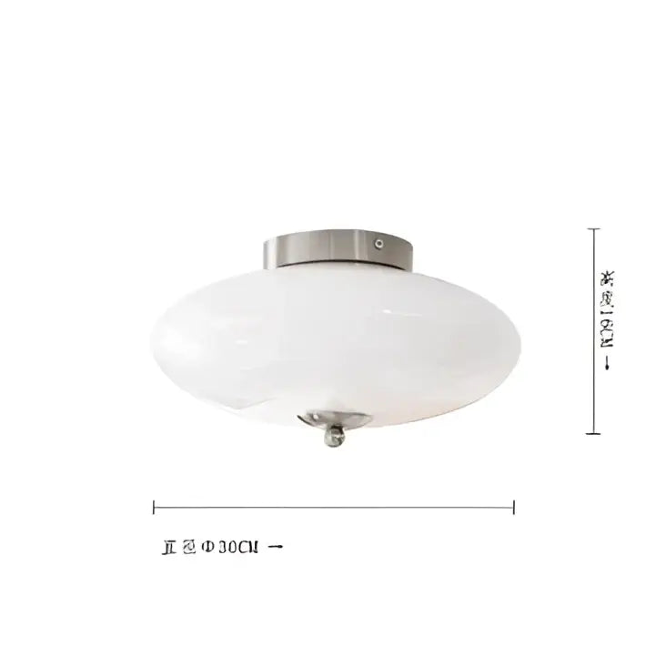 A sleek decorbites cream white ceiling lamp with cream white glass and brushed metal fixture for dining room lighting