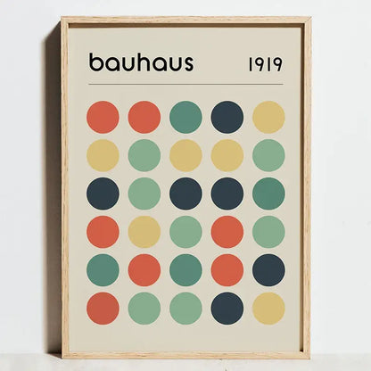 Minimalist framed canvas wall art featuring bauhaus exhibition posters with colorful circles on an off-white background