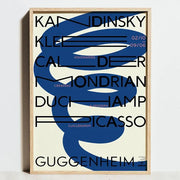 A framed decorbites bauhaus geometric exhibition poster with bold black typography and abstract blue swirls on cream canvas