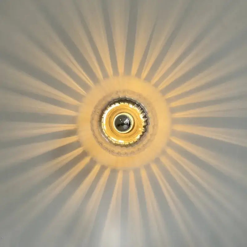 Golden bauhaus glass e14 wall lamp with ribbed clear glass sconce and central circular bulb housing for living room