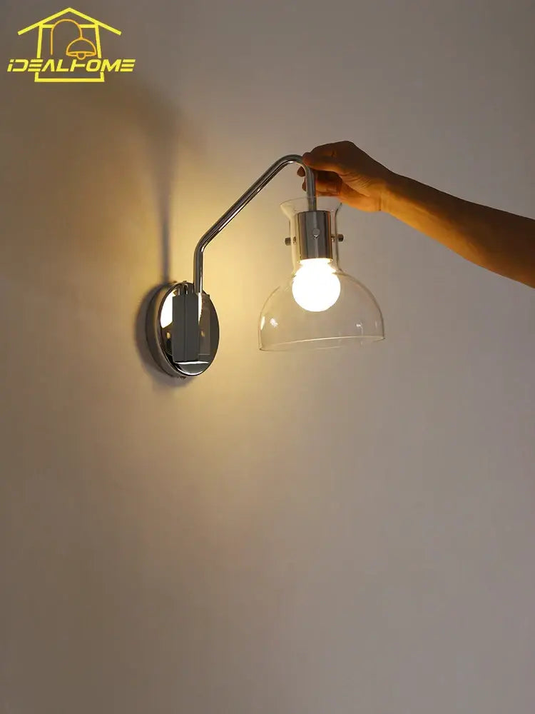 Chrome finished bauhaus glass led wall lamp with curved arm and clear glass dome shade in black metal sconce for bedroom