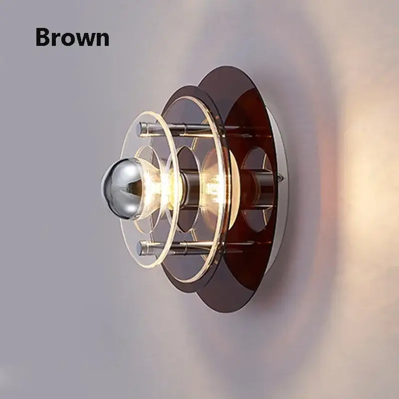 Brown wall sconces with layered circular rings and central bulb for bedroom decorbites led wall sconces