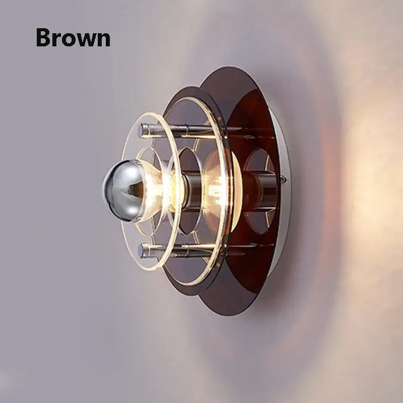 Brown bauhaus led wall sconce with layered circular glass and metal rings for bedroom and living room lighting