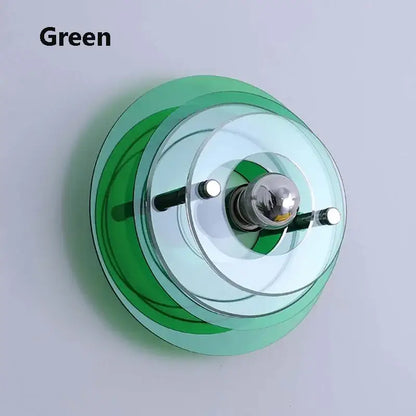 Bauhaus led wall sconce featuring green translucent glass with concentric rings and chrome bulb holder for bedroom use