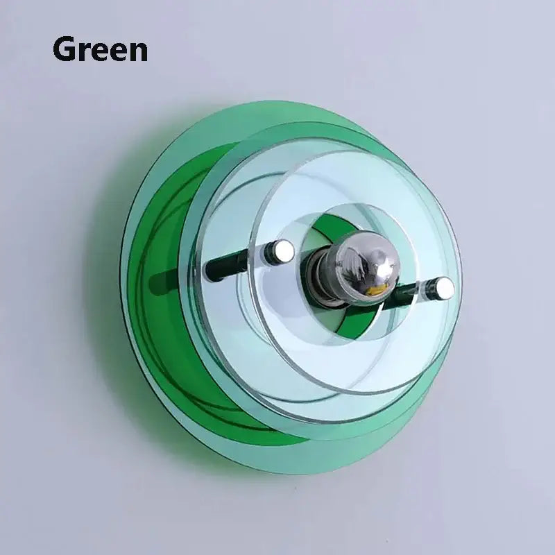 Bauhaus led wall sconce featuring green translucent glass with concentric rings and chrome bulb holder for bedroom use