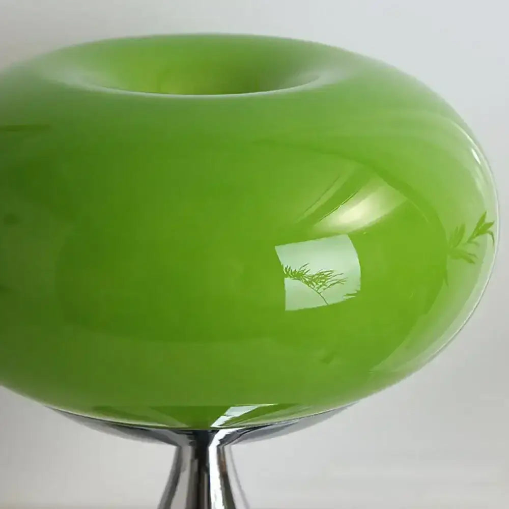 Vibrant lime green glossy ceramic led table lamp with leaf etchings and chrome pedestal base for living room use