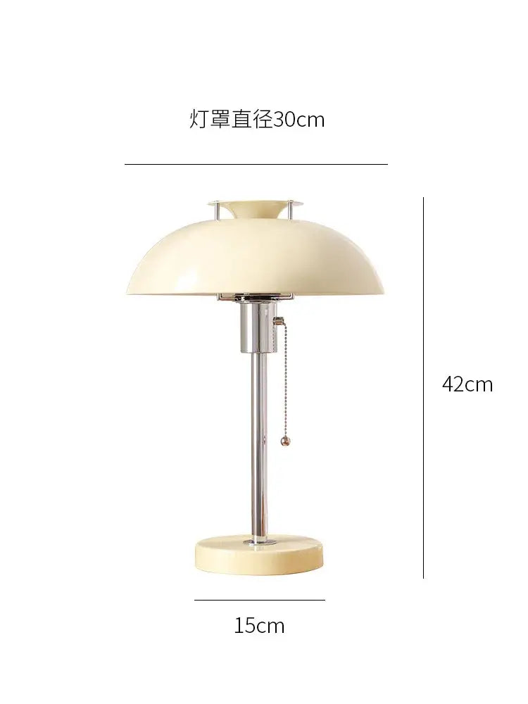 Cream-colored dome-shaped lampshade bauhaus led table lamp with sleek chrome stem and base for bedroom or living room