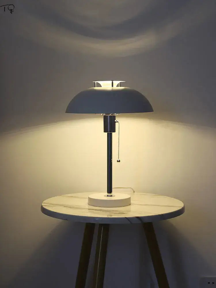 Bauhaus led table lamp with matte gray dome shade chrome stem and glossy red base for bedroom or living room use