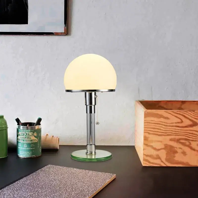 Bauhaus mushroom table lamp with frosted white glass dome shade and polished chrome stem for bedroom use