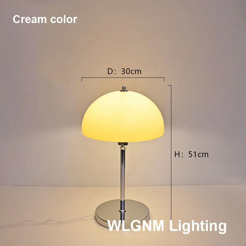 Cream-colored bauhaus mushroom table lamp with chrome base and stem for bedroom night light use