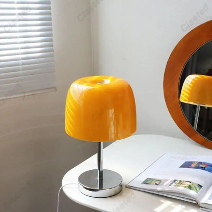 Vibrant orange bauhaus retro table lamp with glass shade and sleek chrome base ideal for bedroom use