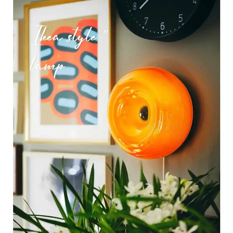 Vibrant bauhaus orange glass table lamp with glossy circular design ideal for bedroom donut desk lighting