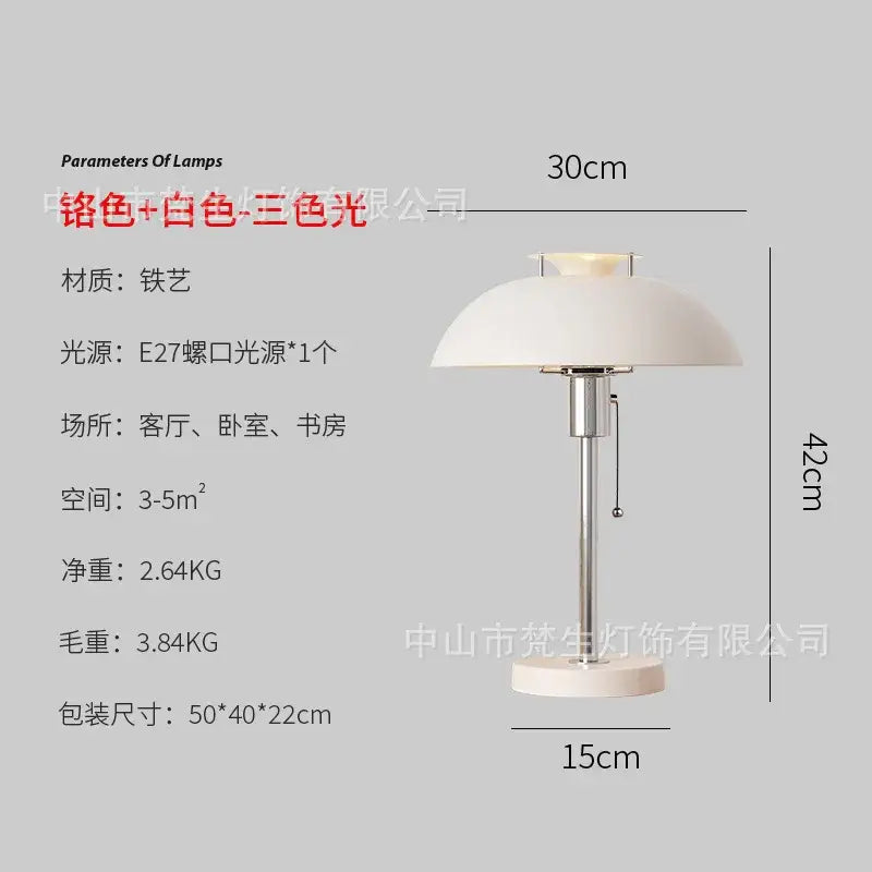 A sleek bauhaus led table lamp with a white ceramic dome shade and polished chrome metal base for bedroom use