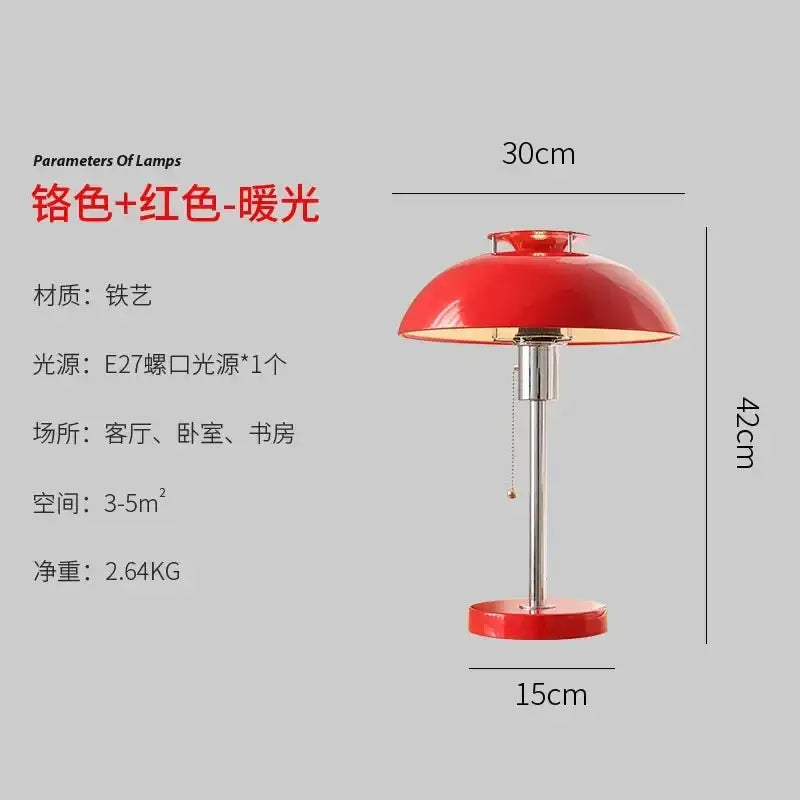 A vibrant red glossy ceramic bauhaus led table lamp with a dome shape and chrome base for bedroom use