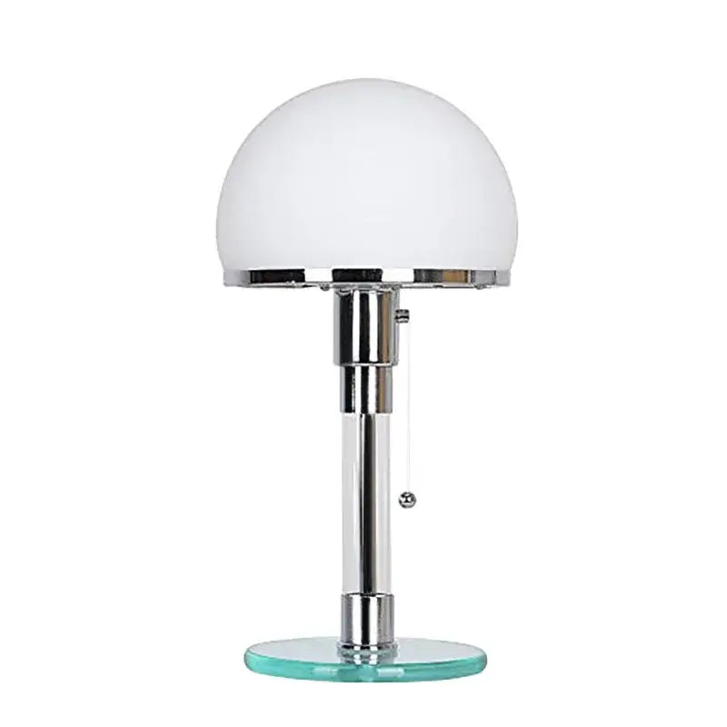 Chrome finished bauhaus glass ball desk lamp with frosted white dome shade and translucent teal glass base for bedroom use