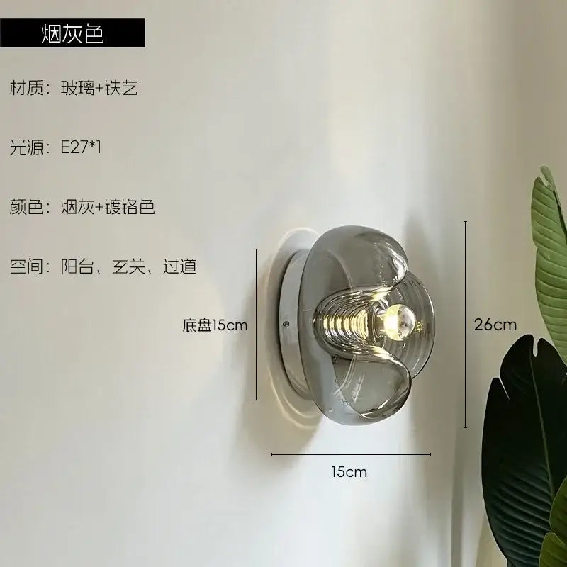 A sleek smoke-gray bauhaus wavy glass wall lamp with chrome finish for modern bedroom lighting