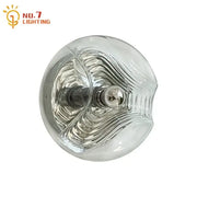 Clear bauhaus wavy glass wall lamp with metallic wave pattern and central bulb for bedroom lighting