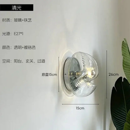 Modern bauhaus wavy glass wall lamp with clear glass and chrome metal in elegant spiral design for bedroom lighting