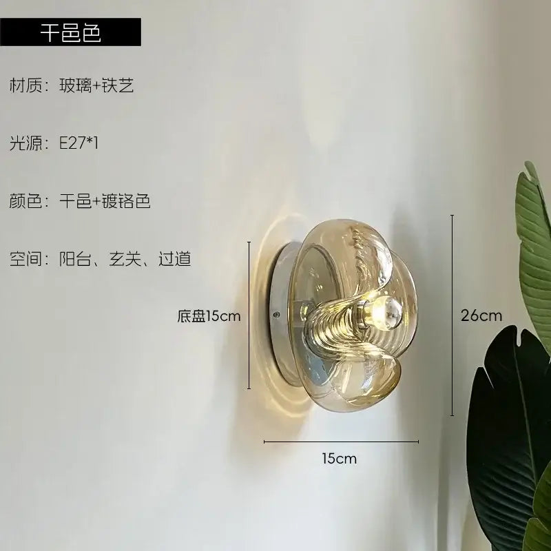 Bauhaus wavy glass wall lamp with translucent amber glass and polished chrome base for bedroom lighting