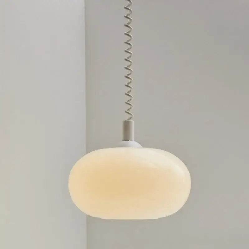 Bauhaus glass pendant light with frosted white and yellow glass shade and metallic spiral cord for dining room