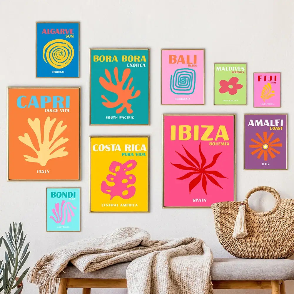 A woven straw tote bag with tassel handle shown with decorbites beach travel posters for living room decor
