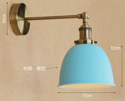 Blue dome-shaped wall lamp with brass accents and iron construction.